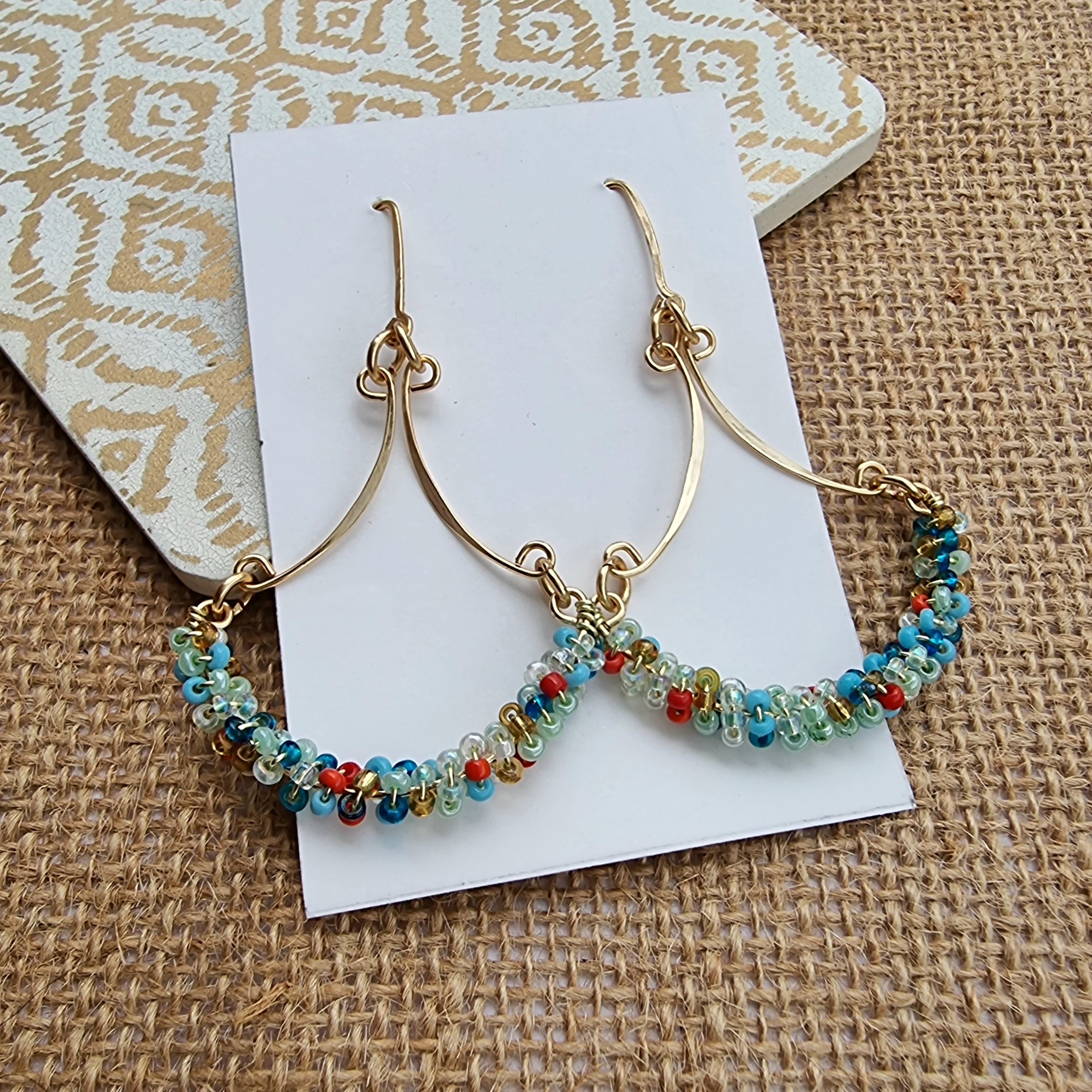 Handcrafted gold-plated wire earrings with multicoloured seed beads - Anne Lawal Jewellry