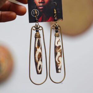 Rawcraft's Boho cowrie earring made from brass and bone