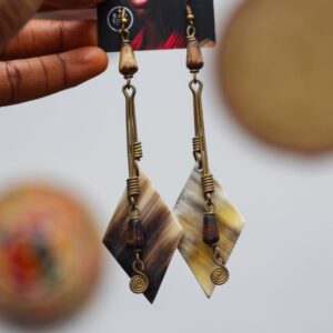 Rawcraft's Boho cowrie earring made from brass and bone